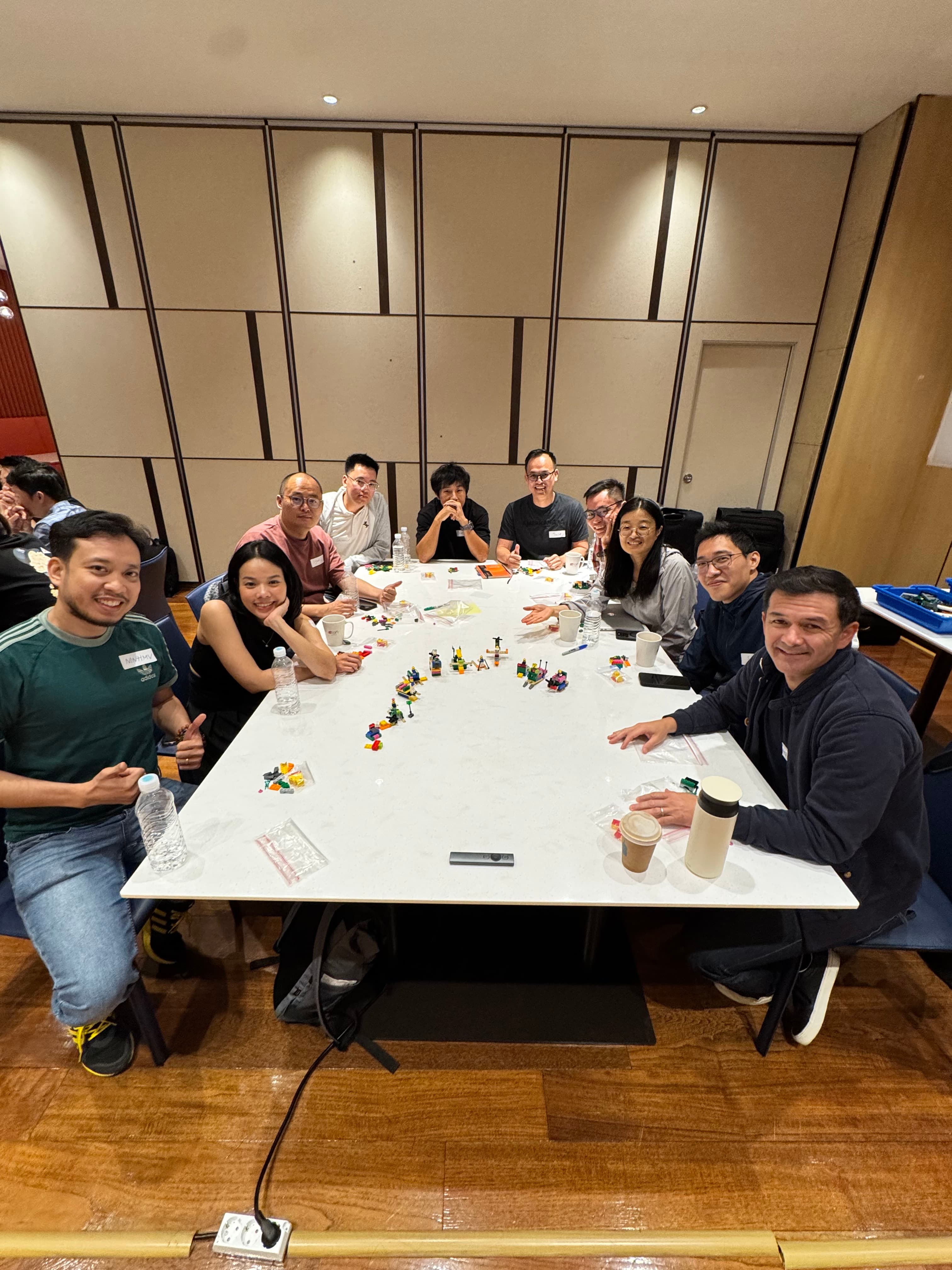 Team smiling together after a workshop session